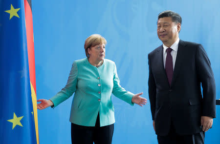 German Chancellor Angela Merkel and Chinese President Xi Jinping are seen after the news conference at the Chancellery in Berlin, Germany, July 5, 2017. REUTERS/Axel Schmidt
