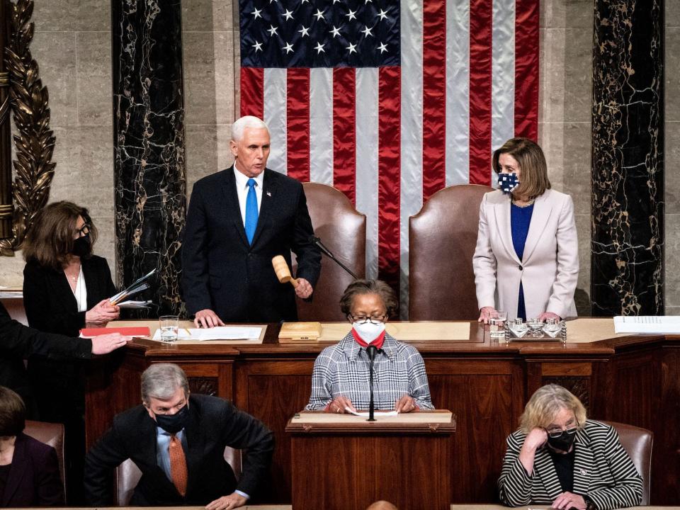 Then-US Vice President Mike Pence and Speaker Nancy Pelosi preside over a joint session of Congress on January 6, 2021 in Washington, DC, reconvening to ratify President-elect Joe Biden's 306-232 Electoral College win over President Donald Trump, hours after a pro-Trump mob broke into the US Capitol and disrupted the proceedings.