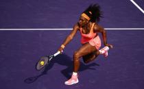 Serena Williams of the United States plays a backhand volley against Monica Niculescu of Romania in their second round match during the Miami Open on March 28, 2015 in Key Biscayne, Florida