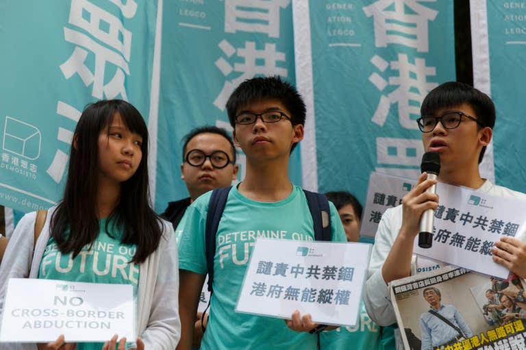 Joshua Wong (C) and other pro-democracy activists in Hong Kong gathered on June 17, 2016, after the revelations from a city bookseller about his detention in China