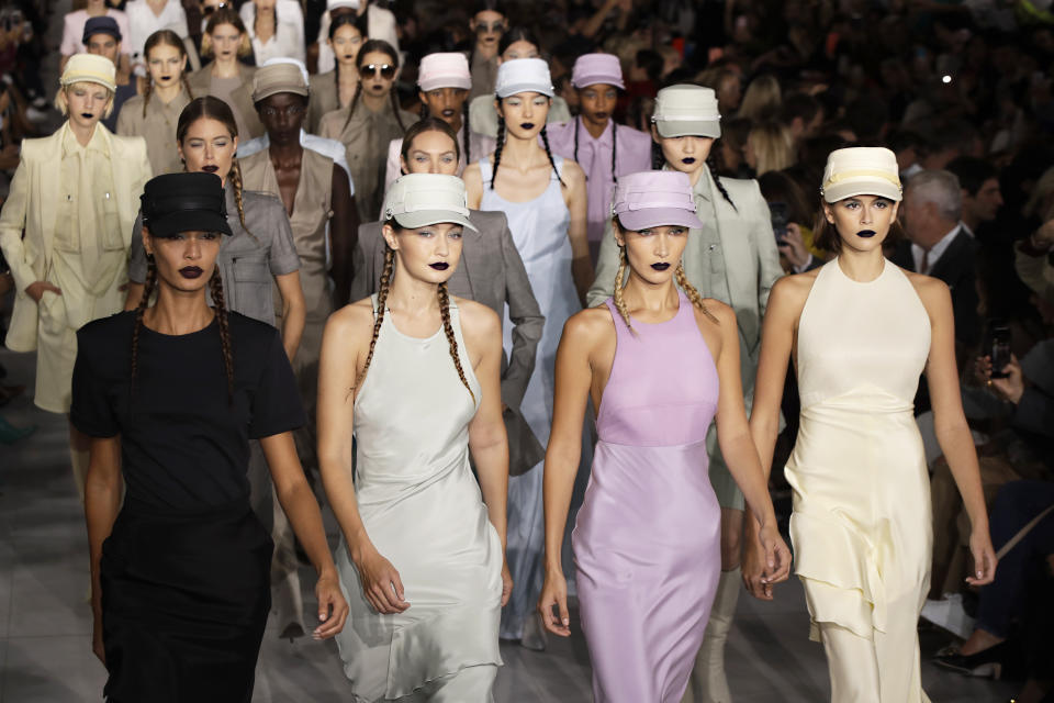Models Gigi Hadid, from front second left, Bella Hadid and Kaia Gerber wear creations with other models as part of the Max Mara Spring-Summer 2020 collection, unveiled during the fashion week, in Milan, Italy, Thursday, Sept. 19, 2019. (AP Photo/Luca Bruno)