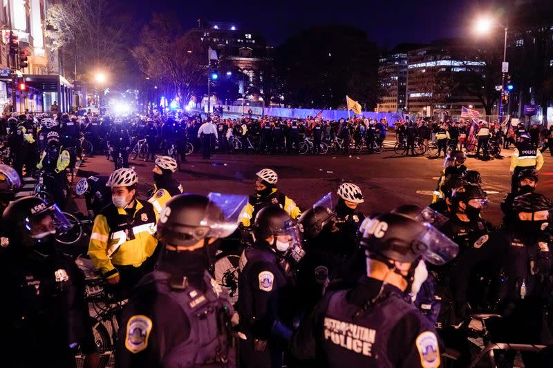 Members of the far-right group Proud Boys clash with counter protesters, in downtown Washington