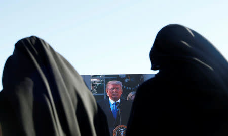 Nuns watch as U.S. President Donald Trump remotely addresses the March for Life rally by satellite from the nearby White House in Washington, U.S. January 19, 2018. REUTERS/Eric Thayer