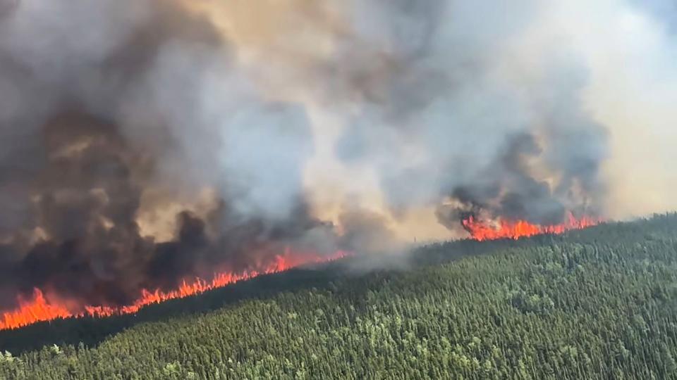 This June 8, 2023, handout still image from a video by British Columbia Wildfire Service, shows an aerial view of the West Kiskatinaw River wildfire located 10kms (6 miles) east of Tumbler Ridge, Canada. Dozens of fires are still burning in the west of the country: 62 in Alberta, 76 in westernmost British Columbia and 24 in Saskatchewan. (Photo by Handout / BC Wildfire Service / AFP)