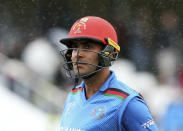 Afghanistan's Hashmatullah Shahidi leaves the pitch after rain stops play during the ICC Cricket World Cup group stage match between Afghanistan and New Zeland, at the County Ground Taunton, England, Saturday, June 8, 2019. (Mark Kerton/PA via AP)