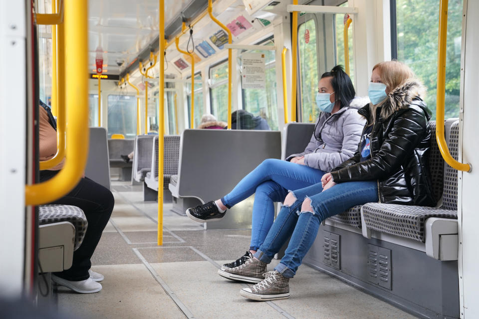 Passengers wearing face masks on a train in Newcastle as face coverings become mandatory on public transport in England with the easing of further lockdown restrictions during the coronavirus pandemic.