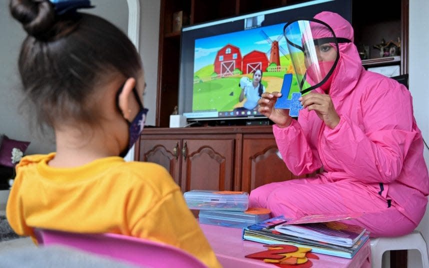 The 'teacher at home' scheme has been implemented by a local school. CREDIT: GETTY - LUIS ROBAYO /Getty