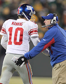 Tom Coughlin congratulates Eli Manning after a touchdown drive