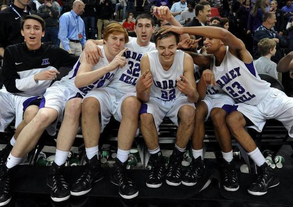 Ardrey Kell’s Steven Santa-Ana, cener, has his hair messed up as he poses with teammates, from left, Michael Crosby (24), Josh Freund (32) and Rhyle Scott (23) following their victory over West Charlotte. Steven Santa-Ana (22) hit the game winning three-point shot in the closing seconds vs West Charlotte. Ardrey Kell defeated West Charlotte 52-50 to win the NCHSAA 4A boys regional championship game at Lawrence Joel Veterans Memorial Coliseum in Winston-Salem on March 7, 2015.