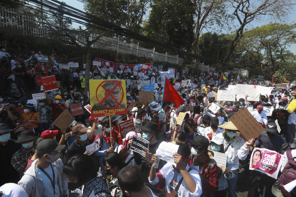 Anti-coup protesters gather outside U.S. Embassy in Yangon, Myanmar, Saturday, Feb. 13, 2021. Mass street demonstrations in Myanmar have entered their second week with neither protesters nor the military government they seek to unseat showing any signs of backing off from confrontations. (AP Photo)
