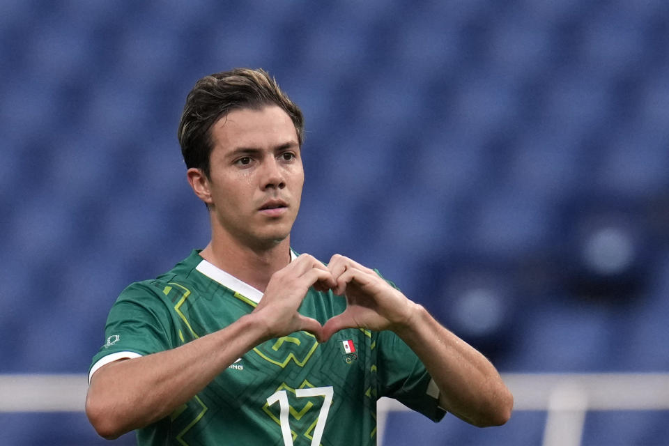 Mexico's Sebastian Cordova celebrates scoring the opening goal against Japan during the men's bronze medal soccer match at the 2020 Summer Olympics, Friday, Aug. 6, 2021, in Saitama, Japan. (AP Photo/Gregory Bull)