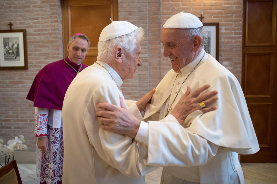 FILE - Pope Francis, right, hugs Pope Emeritus Benedict XVI in the former Convent Mater Ecclesiae at the Vatican, on Nov. 19, 2016. Pope Benedict XVI’s 2013 resignation sparked calls for rules and regulations for future retired popes to avoid the kind of confusion that ensued. Benedict, the German theologian who will be remembered as the first pope in 600 years to resign, has died, the Vatican announced Saturday Dec. 31, 2022. He was 95. (L'Osservatore Romano/Pool Photo via AP, File)