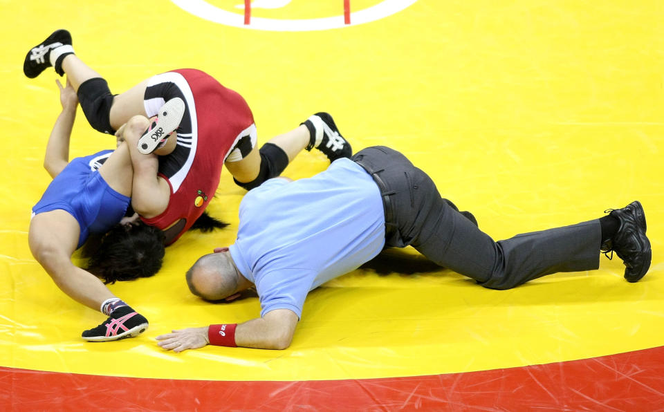 Clarissa Chun (blue) wrestles Patricia Miranda (blue) in the Championship match for 48 kg during the USA Olympic trials for Wrestling and Judo on June 13, 2008 at the Thomas and Mack Center in Las Vegas, Neveda. (Jonathan Ferrey/Getty Images)