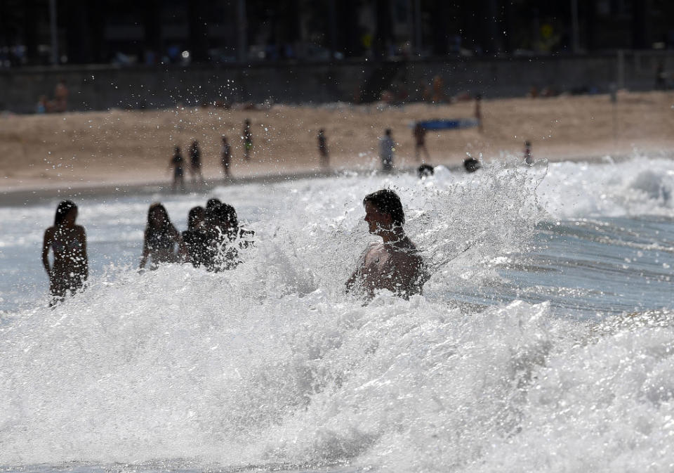 Beachgoers spend their afternoon at Manly Beach in Sydney.