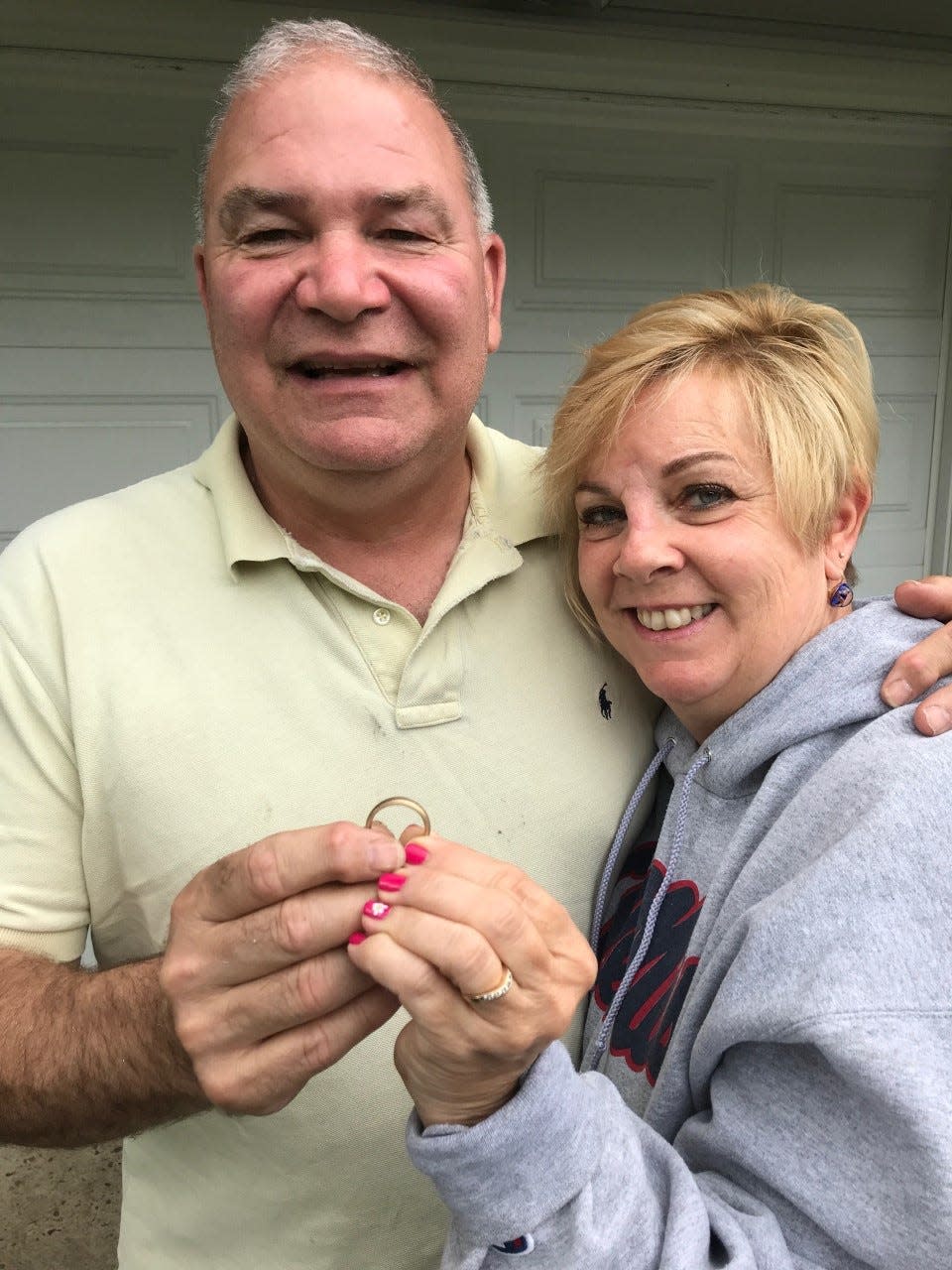 Shawn and Debbie Emery of Glen Rock with his wedding ring, recovered after 28 years in time for their 30th anniversary.