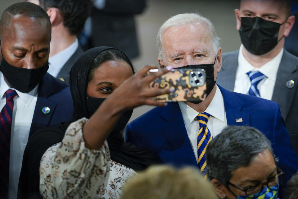 President Joe Biden poses for a photo after speaking at Dakota County Technical College, in Rosemount, Minn., Tuesday, Nov. 30, 2021. (AP Photo/Carolyn Kaster)