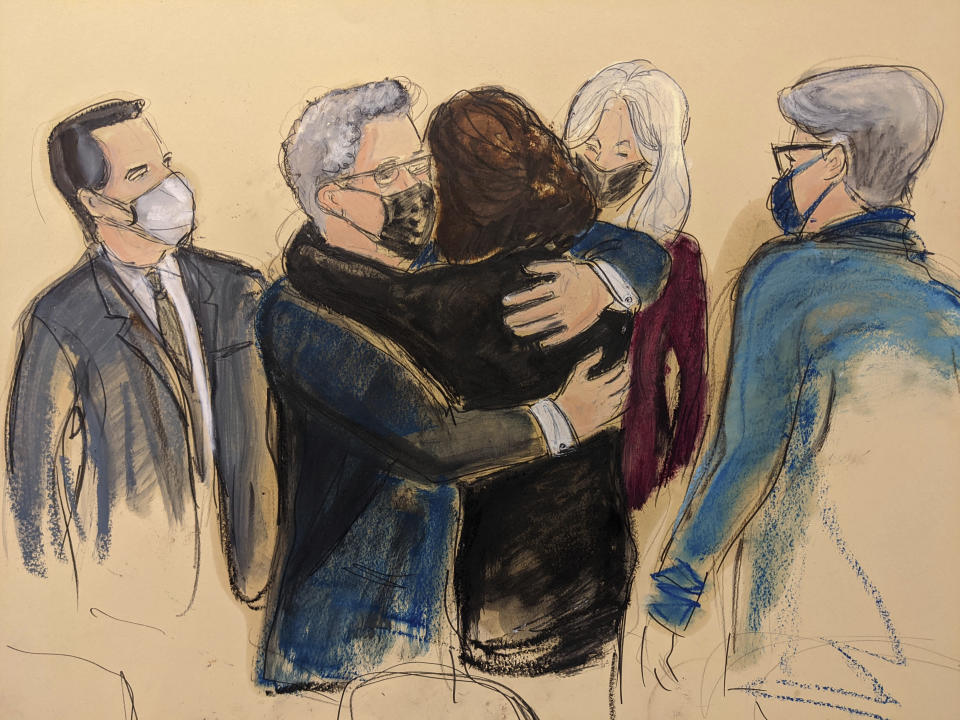 FILE - In this courtroom sketch, Ghislaine Maxwell, center, is hugged by attorney Jeffrey Pagliuca as other members of her defense team look on, as she enters court for the voire dire portion of jury selection, Tuesday, Nov. 16, 2021, in New York. (AP Photo/Elizabeth Williams, File)