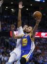 Golden State Warriors guard Stephen Curry (30) shoots in front of Oklahoma City Thunder forward Andre Roberson during the first quarter of an NBA basketball game in Oklahoma City, Monday, March 20, 2017. (AP Photo/Sue Ogrocki)