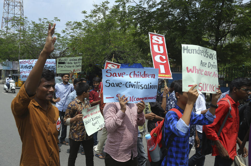 Activists of Socialist Unity Centre of India (Communist) shout slogans condemning deaths of more than 100 children in an encephalitis outbreak this month in eastern Bihar state, during a protest in Hyderabad, India, Monday, June 24, 2019. (AP Photo/Mahesh Kumar A.)