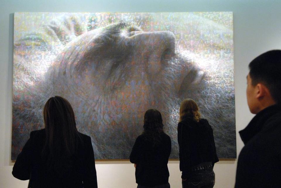 Cosumnes River College art history students study the painting “Portrait of My Father” by Stephen Kaltenbach during a tour at the Crocker Art Museum in 2007.