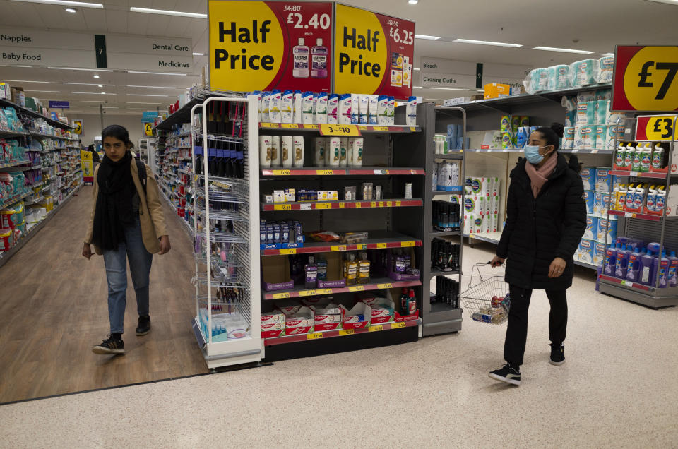 A woman wearing a face covering to protect against Coronavirus carries a shopping basket past a selection of goods that are reduced to half price in a Morrisons supermarket amid warnings from poverty and food activist Jack Monroe that the country's worsening cost of living crisis could potentially be fatal for its poorest children on 7th March, 2022 in Leeds, United Kingdom. A new report from the Resolution Foundation predicts inflation in the country could peak at 8.3%, far higher than the Bank of England's original forecast, stretching household incomes even thinner as the cost of energy and basic goods surge. (photo by Daniel Harvey Gonzalez/In Pictures via Getty Images)