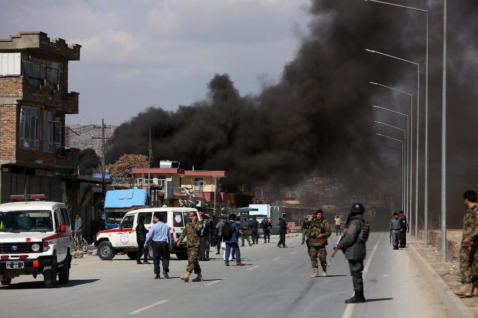 Smoke rises from a district police headquarters after a suicide bombing in Kabul, Afghanistan, Wednesday, March 1, 2017. An Afghan official says that a suicide car bomber attacked at the gates of a police station in the western part of the capital, Kabul. (AP Photo/ Rahmat Gul)