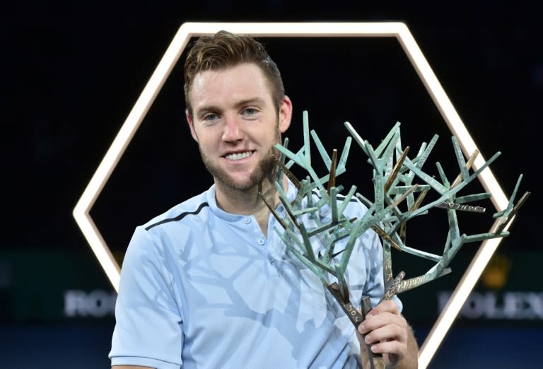 Jack Sock of the US poses with the trophy after defeating Serbia's Filip Krajinovic in the final of the ATP World Tour Masters 1000 indoor tournament in Paris, on November 5, 2017