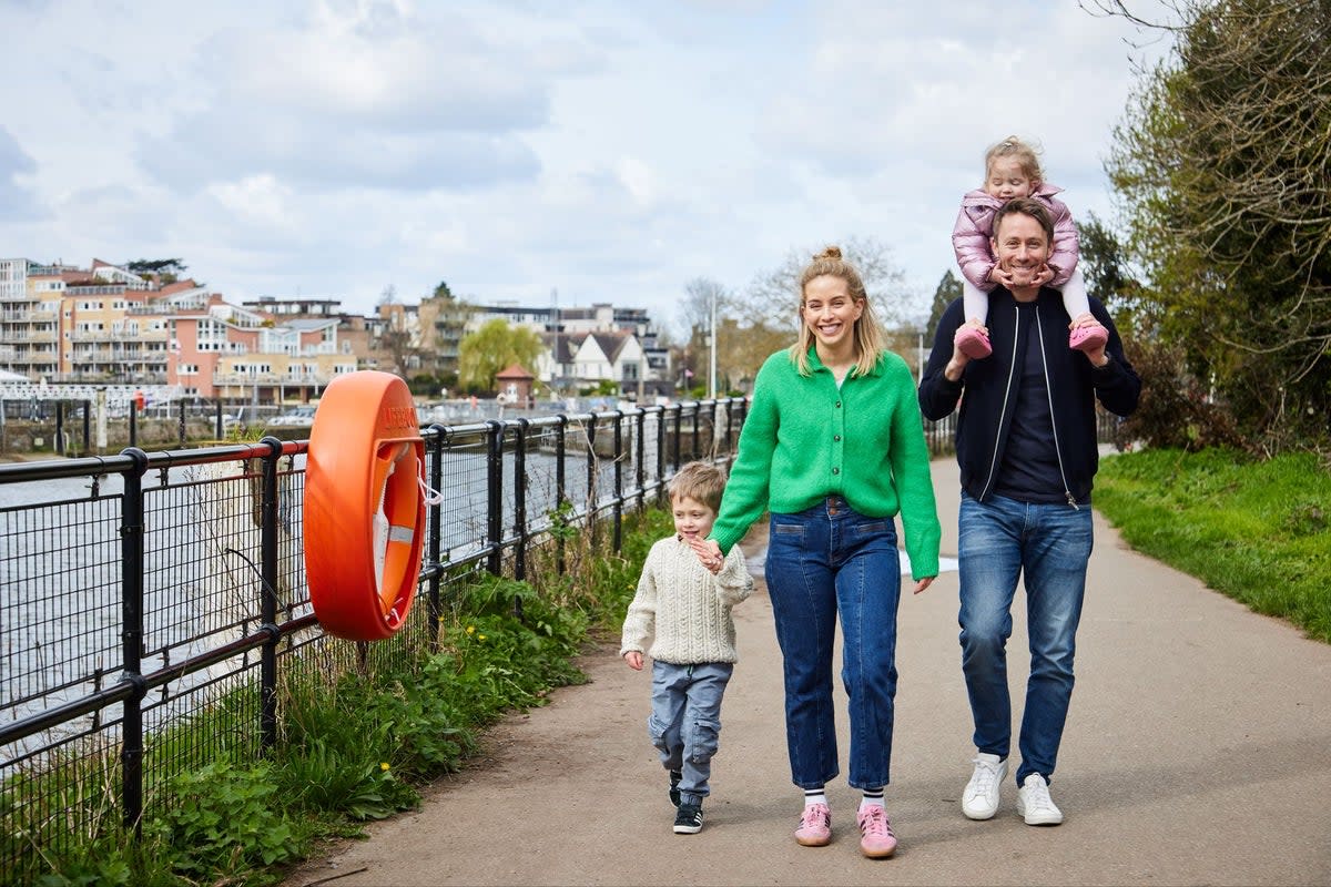 Charlie and Greg Helmich with their children in Teddington, where they now call home (Juliet Murphy)