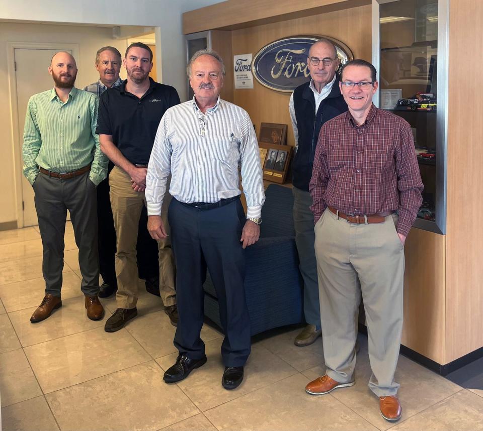 From the left, a recent photo of Jarod Schaffner, comptroller, Craig Schaffner, co-owner, Brandon Schaffner, parts manager, Rick Schaffner, co-owner, Kent Ahrens, accounts payable manager, and Nathan Schaffner, finance manager stand in the showroom.