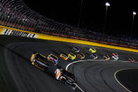 CHARLOTTE, NC - MAY 19: Dale Earnhardt Jr., driver of the #88 Dale Jr. Foundation/National Guard/Diet Mountain Dew Chevrolet, races Marcos Ambrose, driver of the #9 DEWALT Ford, during the NASCAR Sprint All-Star Race at Charlotte Motor Speedway on May 19, 2012 in Charlotte, North Carolina. (Photo by Chris Graythen/Getty Images)