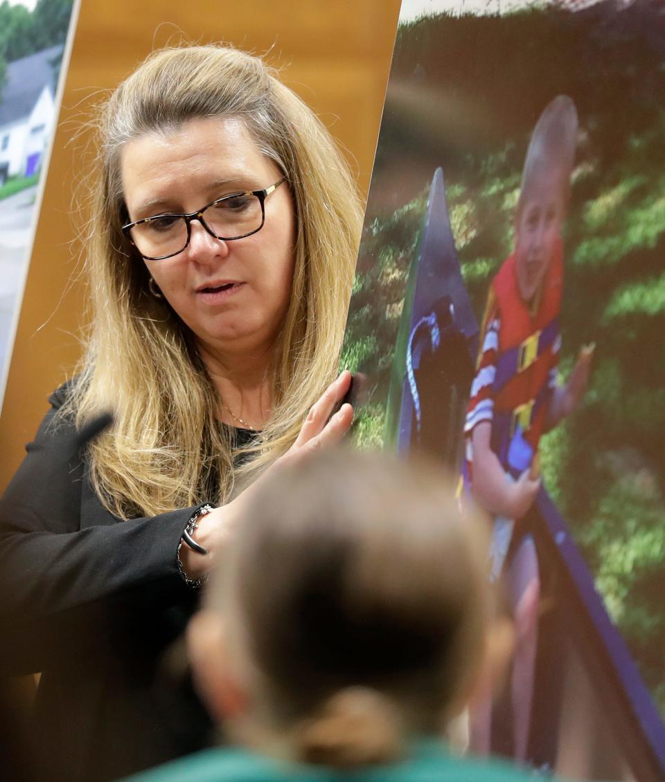 Outagamie County District Attorney Melinda Tempelis stands with a photo of William Beyer during closing arguments in Matthew Beyer's homicide trial on Tuesday, December 13, 2022, in Outagamie County Circuit Court in Appleton, Wis.