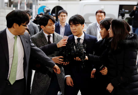 Seungri, a member of South Korean K-pop band Big Bang, arrives to be questioned over a sex bribery case at the Seoul Metropolitan Police Agency in Seoul, South Korea, March 14, 2019. REUTERS/Kim Hong-Ji/Files