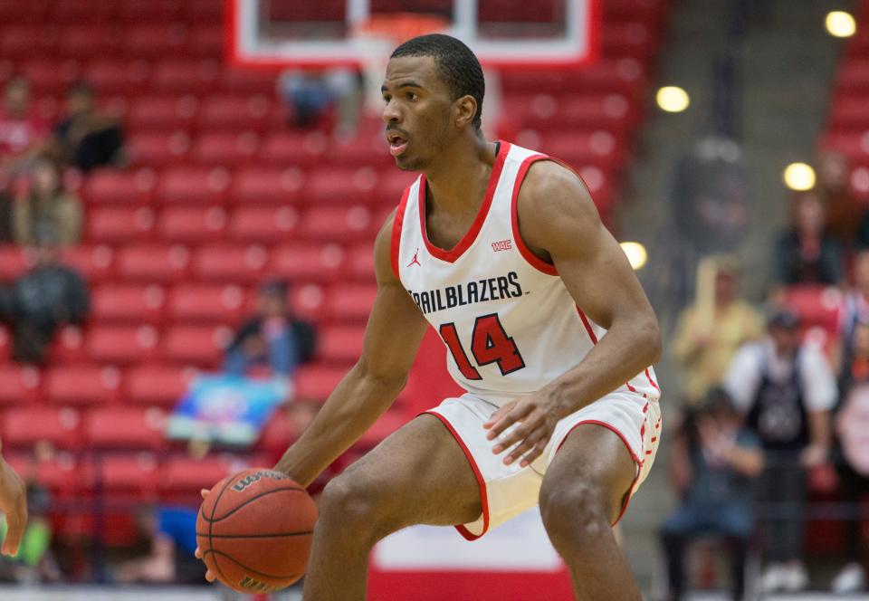 Dixie State's Dancell Leter looks to make a move during the Trailblazers' 87-70 loss to Weber State on Saturday. The Wildcats made a late run to pick up the win and stay undefeated but Leter scored a career-high 17 points, earning praise from Coach Jon Judkins for his agressiveness.