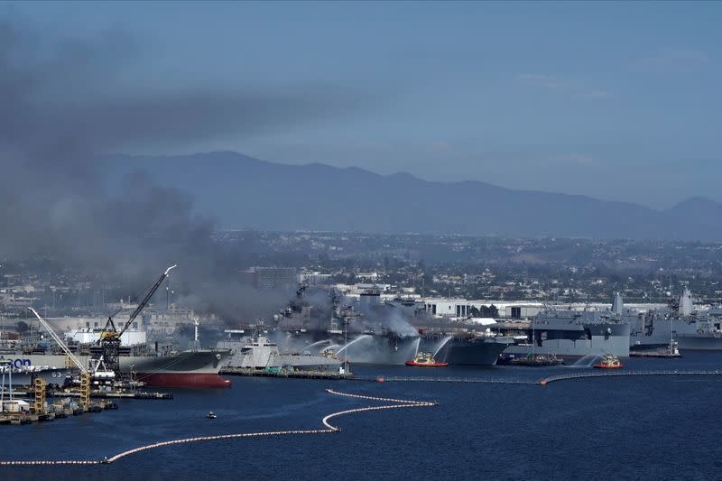 Smoke rises from a fire on board the U.S. Navy amphibious assault ship USS Bonhomme Richard