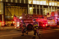 <p>First responders assess the scene of a fire at Trump Tower on April 7, 2018 in New York City. (Photo: Eduardo Munoz Alvarez/Getty Images) </p>