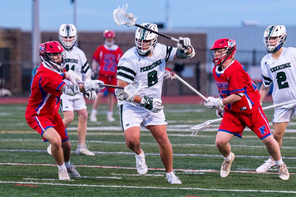 Pennridge's Matthew Seiler (6) gets blocked by Neshaminy's Brett Cohen (4) and Tim Peterson (17) during their boys' lacrosse game in Perkasie on Thursday, April 4, 2024.