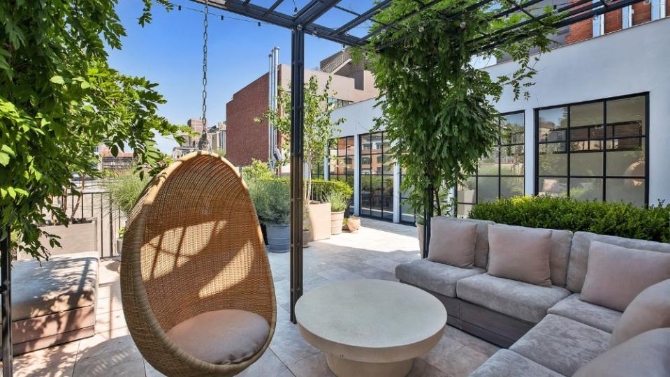 The private rooftop terrace comes with its own sauna, seating area and greenery.