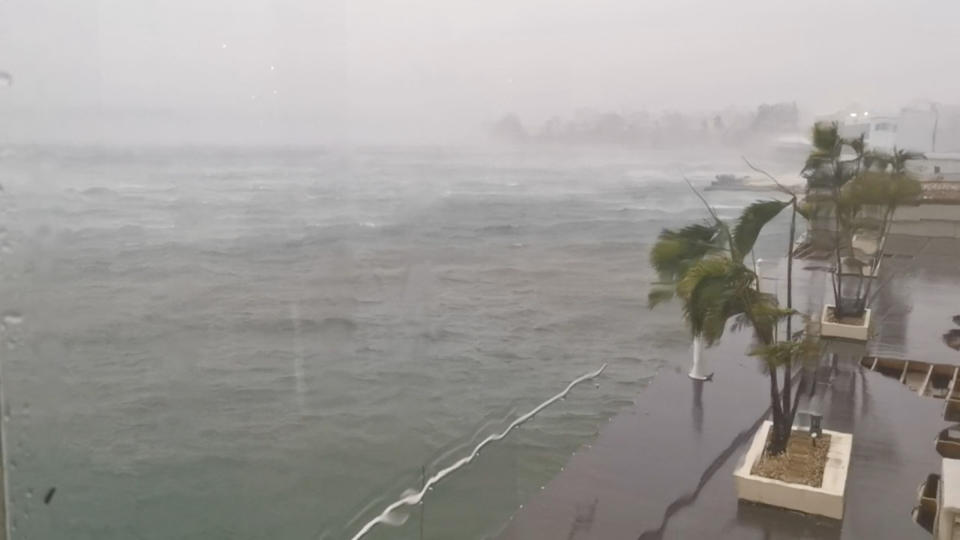 Trees sway in the wind as cyclone Kevin passes over Port Vila, Vanuatu.