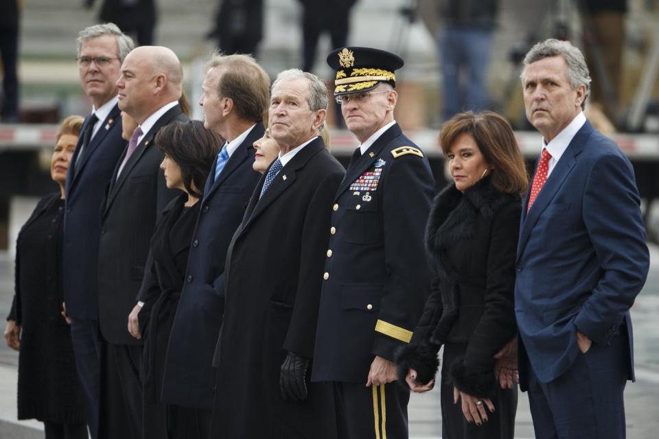<p>Members of the Bush family watch as a joint service honor guard carries the casket of former US President George H.W. Bush out of the US Capitol.</p>