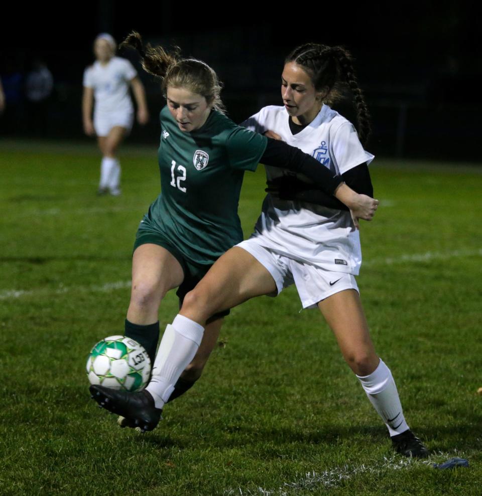 Midfielders, Smithfield's Krista  Kasbarian and Cumberland's Ava Normandin tangle up in their fight for possession of a first half ball Tuesday evening. 