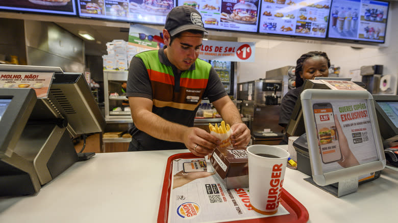 Burger King employees behind counter