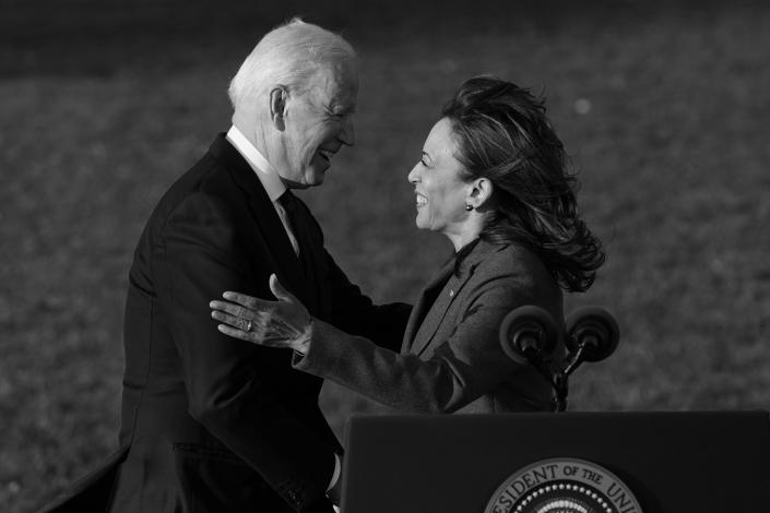 President Joe Biden embraces Vice President Kamala Harris as he speaks before signing the $1.2 trillion bipartisan infrastructure bill into law during a ceremony on the South Lawn of the White House in November. (Susan Walsh/AP)