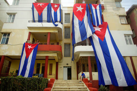 Cuban flags are seen hung up to dry after Hurricane Irma caused flooding and a blackout, in Havana, Cuba September 11, 2017. REUTERS/Alexandre Meneghini