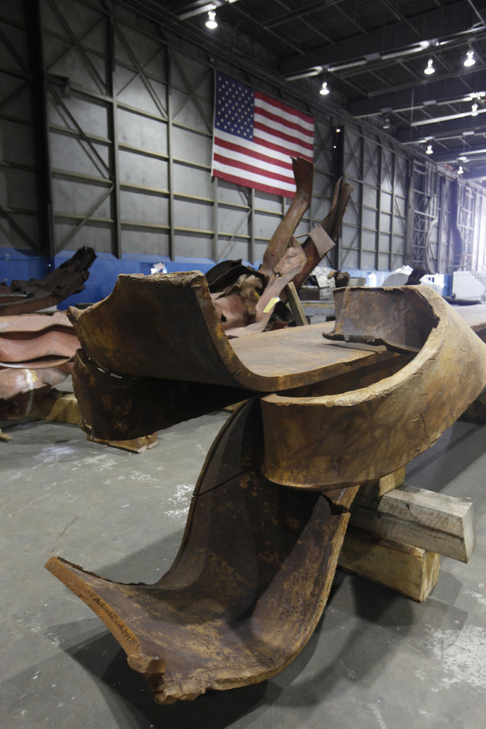 Twisted steel recovered from the World Trade Center sits inside Hangar 17 at New York's John F. Kennedy International Airport June 16, 2011. A program operated by the Port Authority of New York and New Jersey, The World Trade Center steel program, is selecting portions of the steel recovered from the Center and donating it to cities, towns, firehouses and museums around the U.S. and the world who request it for use in 911 memorial sites in time for the 10 year anniversary of the 2001 attacks. Picture taken June 16, 2011. (REUTERS/Mike Segar)