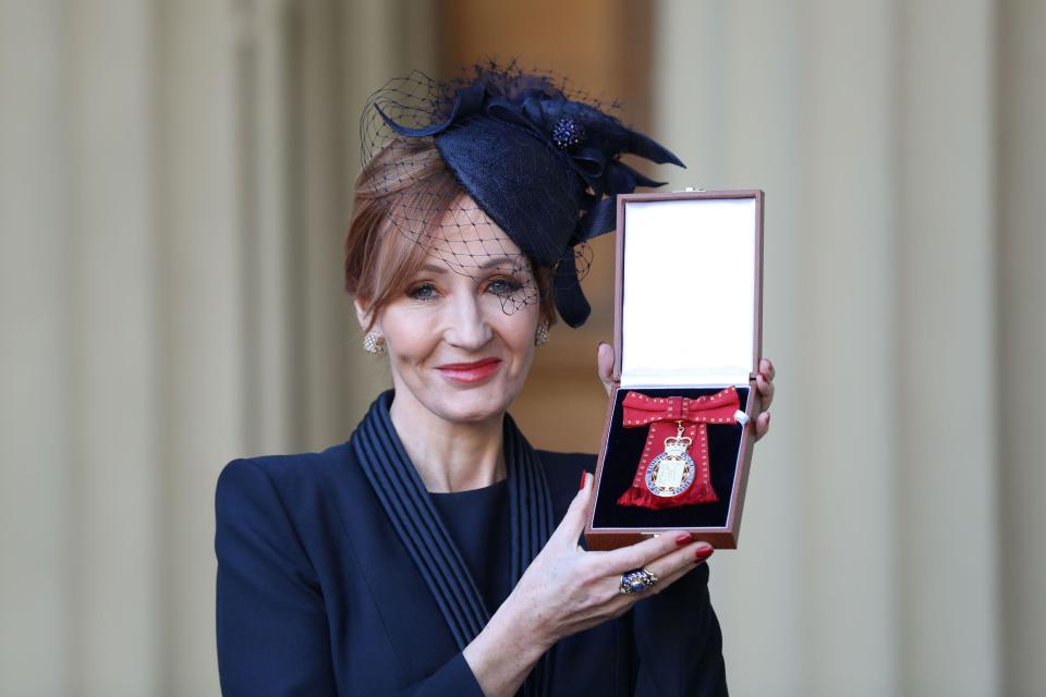 JK Rowling poses for pictures after she was made a Companion of Honour by Britain's Prince William during an Investiture ceremony at Buckingham Palace, in London December 12, 2017. REUTERS/Andrew Matthews/Pool