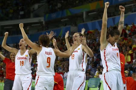 2016 Rio Olympics - Basketball - Semifinal - Women's Semifinal Spain v Serbia - Carioca Arena 1 - Rio de Janeiro, Brazil - 18/8/2016. Laura Quevedo (ESP) of Spain, Laia Palau (ESP) of Spain, Lucila Pascua (ESP) of Spain and Laura Nicholls (ESP) of Spain celebrate. REUTERS/Jim Young