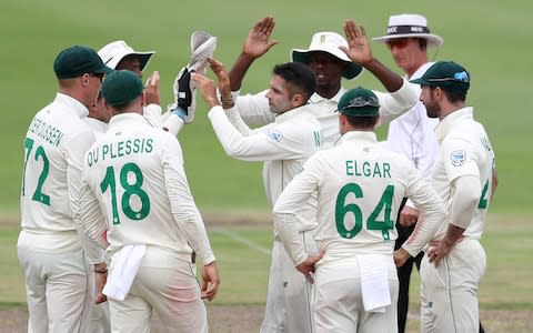 Maharaj and team-mates huddle - Credit: &nbsp;REUTERS/Siphiwe Sibeko