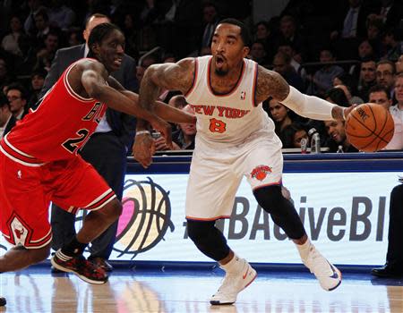 Dec 11, 2013; New York, NY, USA;New York Knicks shooting guard J.R. Smith (8) drives to the basket against Chicago Bulls small forward Tony Snell (20) in the second half of NBA game at Madison Square Garden. Noah K. Murray-USA TODAY Sports