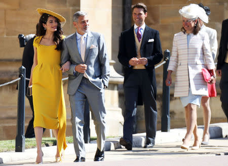 Amal Clooney and George Clooney arrive at the wedding of Prince Harry to Ms Meghan Markle at St George's Chapel, Windsor Castle in Windsor, Britain, May 19, 2018. Chris Jackson/Pool via REUTERS