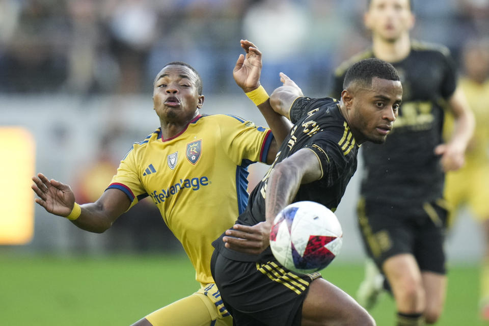 Los Angeles FC defender Diego Palacios, right, shoves Real Salt Lake forward Carlos Andrés Gómez during the first half of an MLS soccer match Sunday, Oct. 1, 2023, in Los Angeles. (AP Photo/Jae C. Hong)